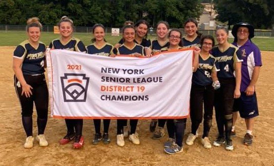 The Pine Bush Senior softball team is shown with the District 19 championship flag after beating Town of Wallkill, 9-8, on Thursday at the Town of Wallkill Little League Field.